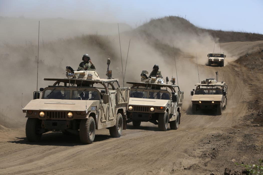 Israeli army training humvees equipped with mock cannon turrets drive during a drill in the Israeli-annexed Golan Heights, near Merom Golan on the border with Syria, on August 3, 2020.