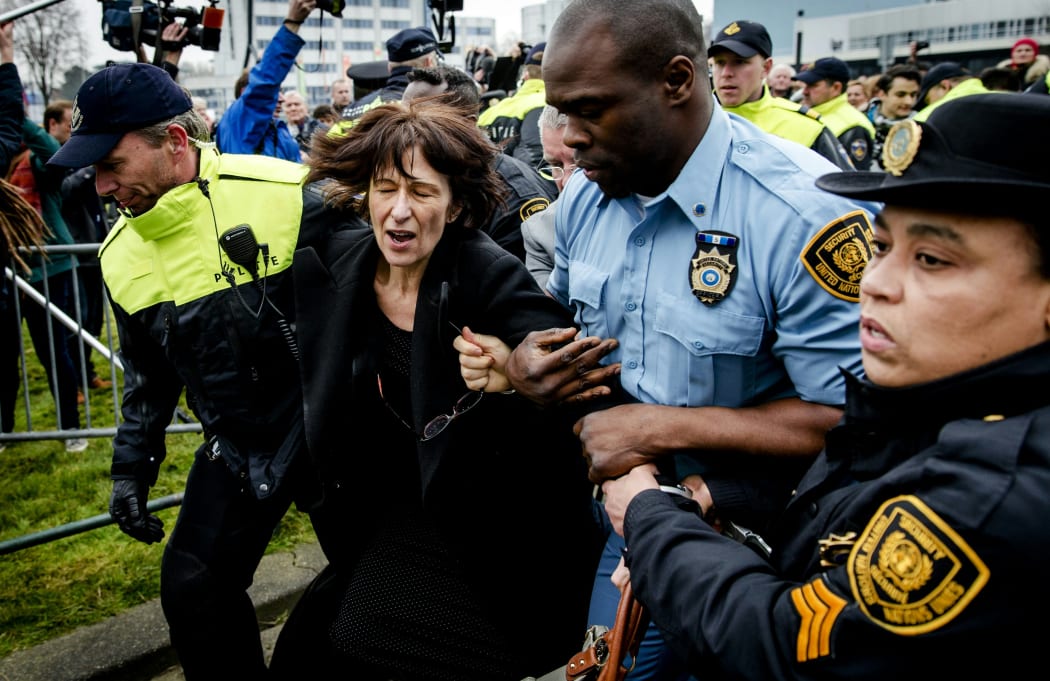 Florence Hartmann is arrested before the reading of the verdict against Bosnian Serb leader Radovan Karadzic on 24 March 2016.