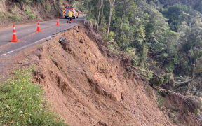 Karekare locals with the aid of officials started clearing blocked roads after Cyclone Gabrielle.