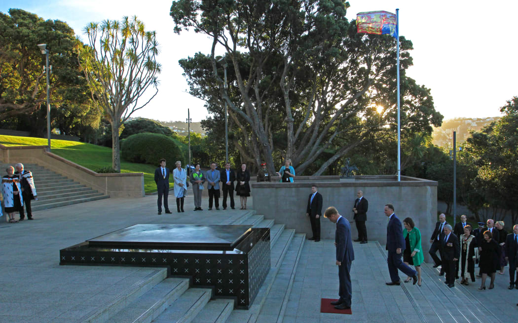 Prince H bowing at the tomb of the unknown soldier.