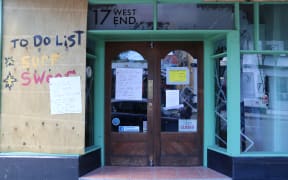 Kaikoura Surf has been shut since the 14 November earthquake. Business owner is Wayne Shanks. His wife Lisa Moffat's shop was next door. The whole building was yellow-stickered so both lost business.
