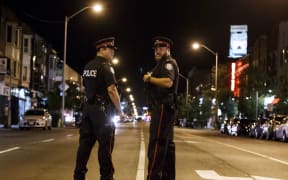 A gunman opened fire in central Toronto, injuring 13 people including a child.