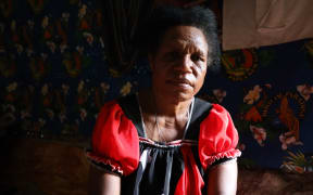 Evelyn Kunda looks at the camera