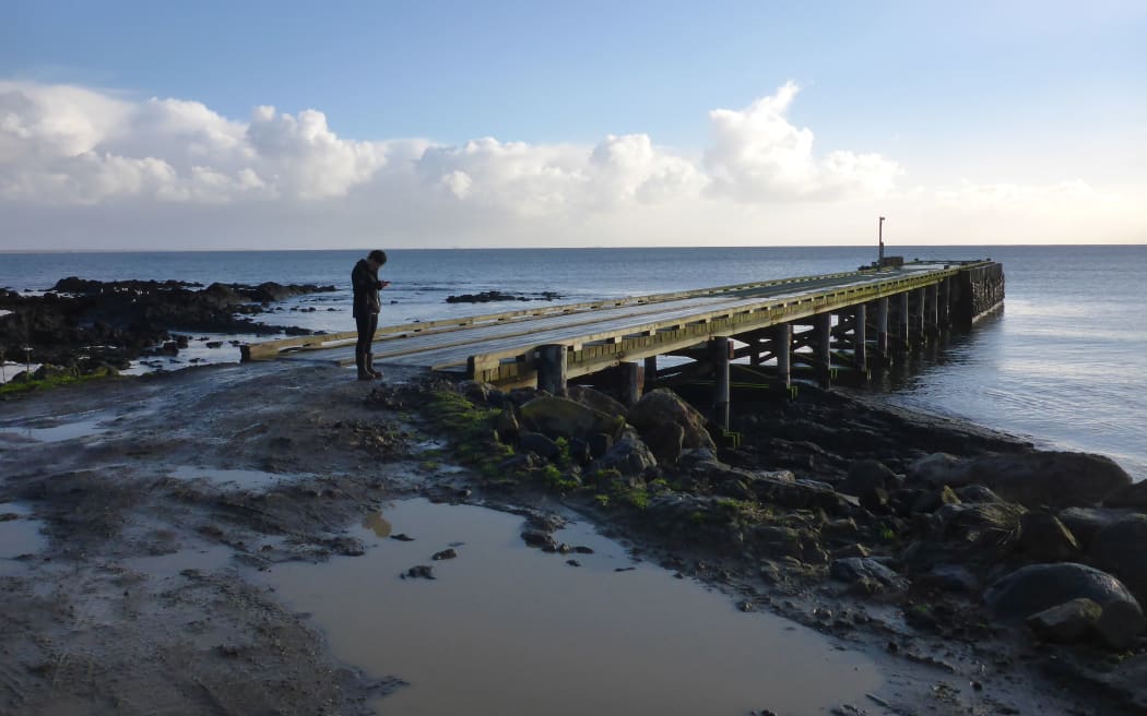Near the main township Waitangi, Chatham Islands, University of Canterbury student Kristie-Lee Thomas is “GPS-ing infrastructure and collecting asset attributes for the impact assessment” for her disaster risk and resilience thesis.