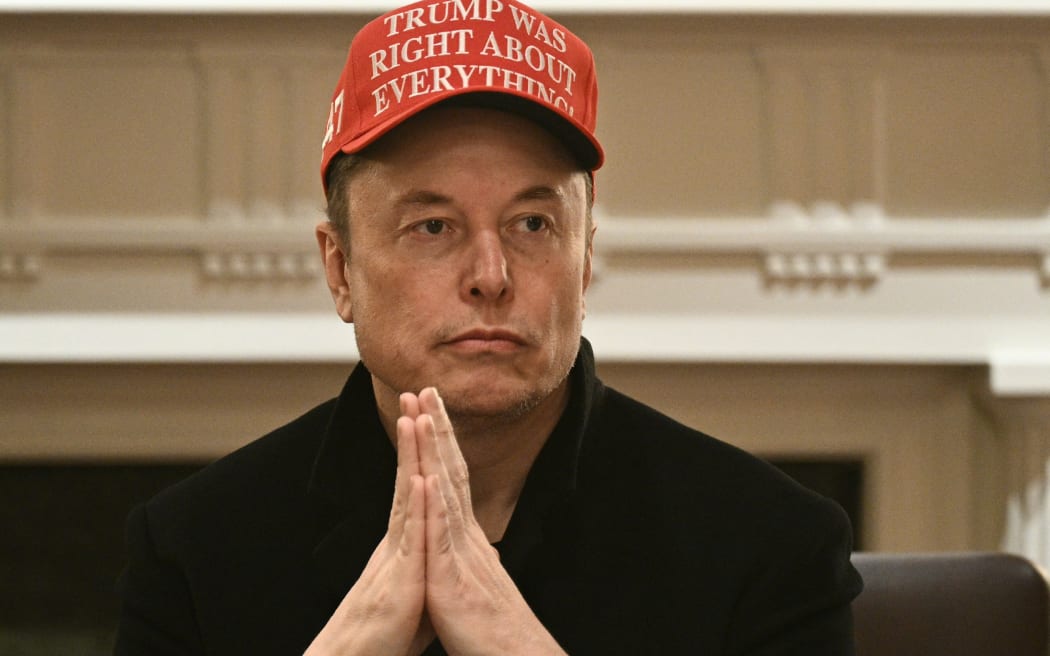 (FILES) Elon Musk looks on as US President Donald Trump hosts a cabinet meeting in the Cabinet Room of the White House on March 24, 2025, in Washington, DC. Musk's rise as President Donald Trump's all-powerful wingman was as rapid and unstoppable as one of his SpaceX rockets. But reports April 2, 2025 are fueling speculation that the billionaire's political career may be coming back to Earth. Politico and ABC News quoted unnamed sources saying Musk could step away from an unprecedented role in which he is spearheading brutal cuts to US government services and has emerged only second to Trump as the face of the administration. (Photo by Brendan SMIALOWSKI / AFP)