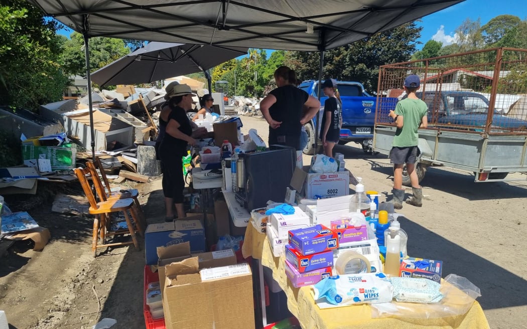 Houses on Joll Road in Havelock North were inundated with contaminated mud during Cyclone Gabrielle, but the community and Navy pitched in to help clean up the street and homes.