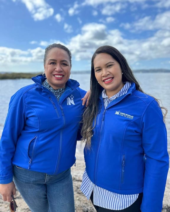 Angee Nicholas (standing right) with fellow National party member Fonoti Agnes Loheni