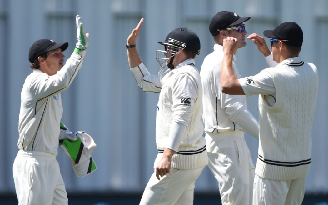 The Black Caps celebrate the wicket of Dimuth Karunaratne on day 1 of the 2nd cricket Test between New Zealand and Sri Lanka in Hamilton, Friday 18 December 2015. Copyright photo: Andrew Cornaga / www.photosport.nz