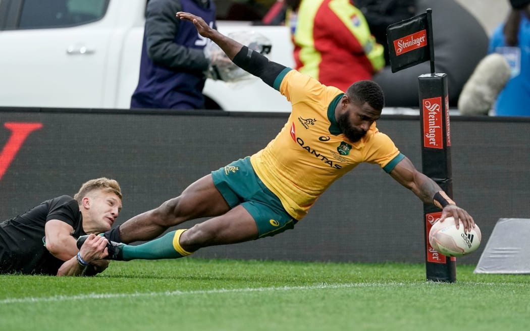 Marika Koroibete goes in to score for the Wallabies.