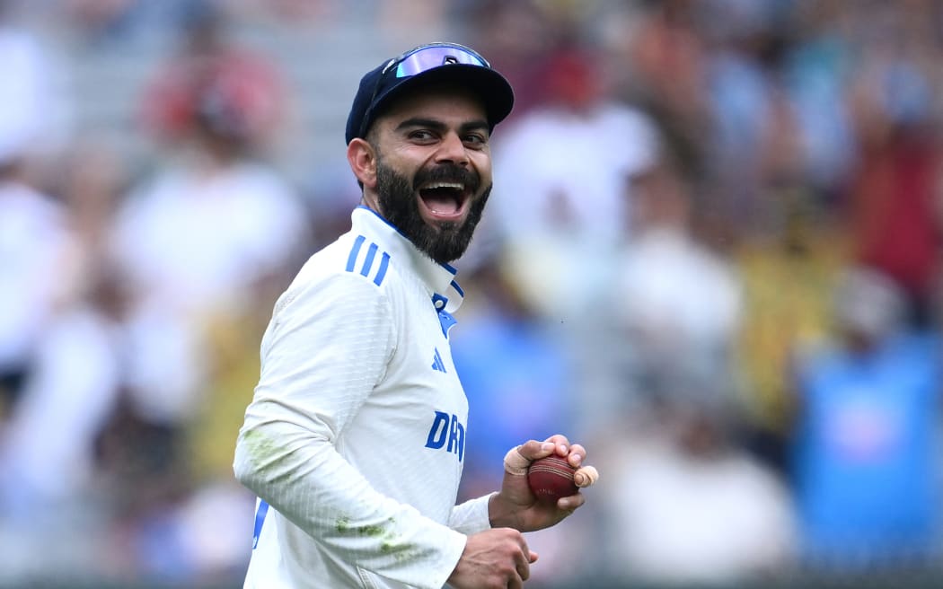 Virat Kohli of India celebrates taking the catch to dismiss Marnus Labuschagne of Australia during the fourth Test between Australia and India at the Melbourne Cricket Ground.