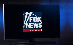 Flat-screen TV set displaying logo of Fox News, an American conservative cable television news channel, owned by the Fox News Group.