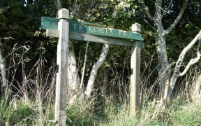 A tattered sign on an empty lot is the only acknowledgement that Te Kohia pā is where the first shots were fired in the Taranaki Wars.