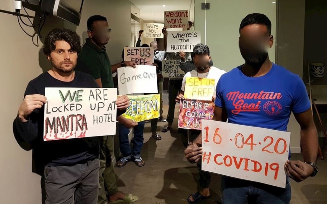 Farhad Bandesh leads the refugee protest in the Melbourne hotel.