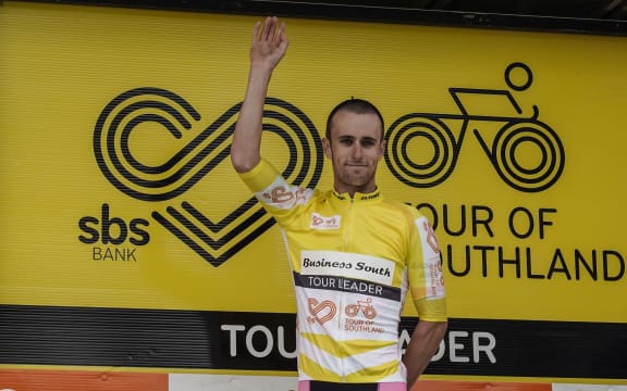 Tom Sexton pulls on the leader's yellow jersey in the 2020 Tour of Southland after his team won the opening prologue team time trial in Invercargill.