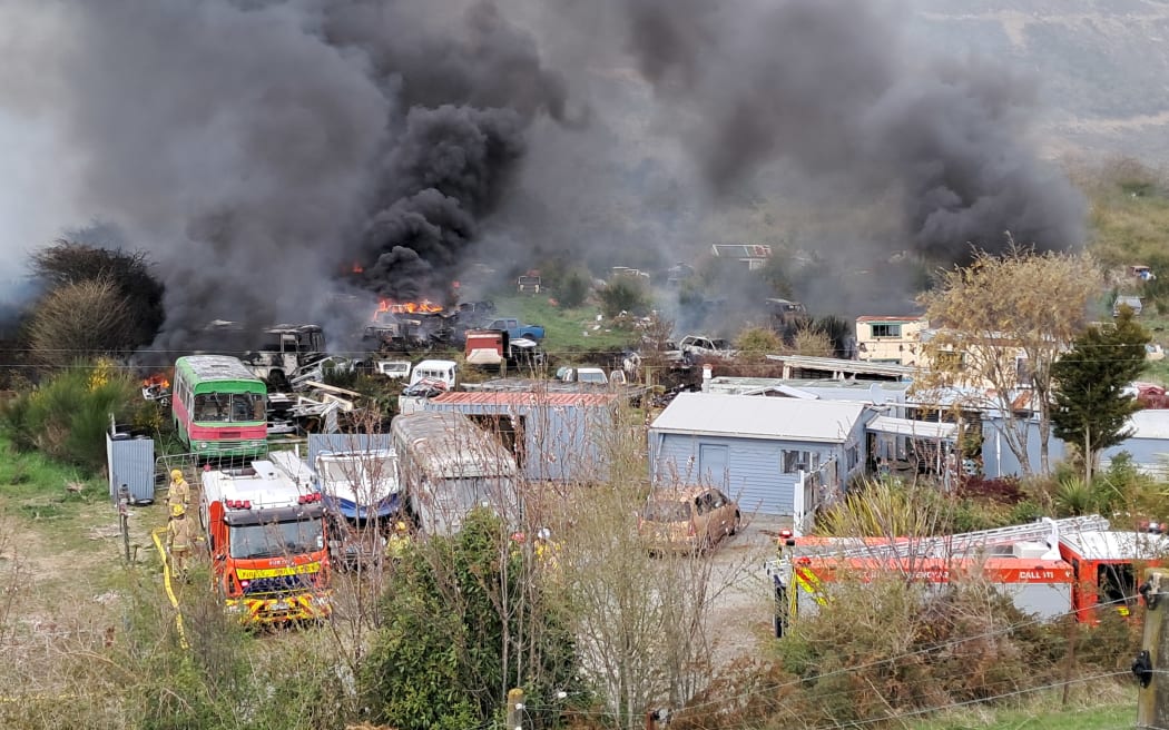 A fire which tore through dozens of cars on a rural property between Nelson and Blenheim has now been contained.