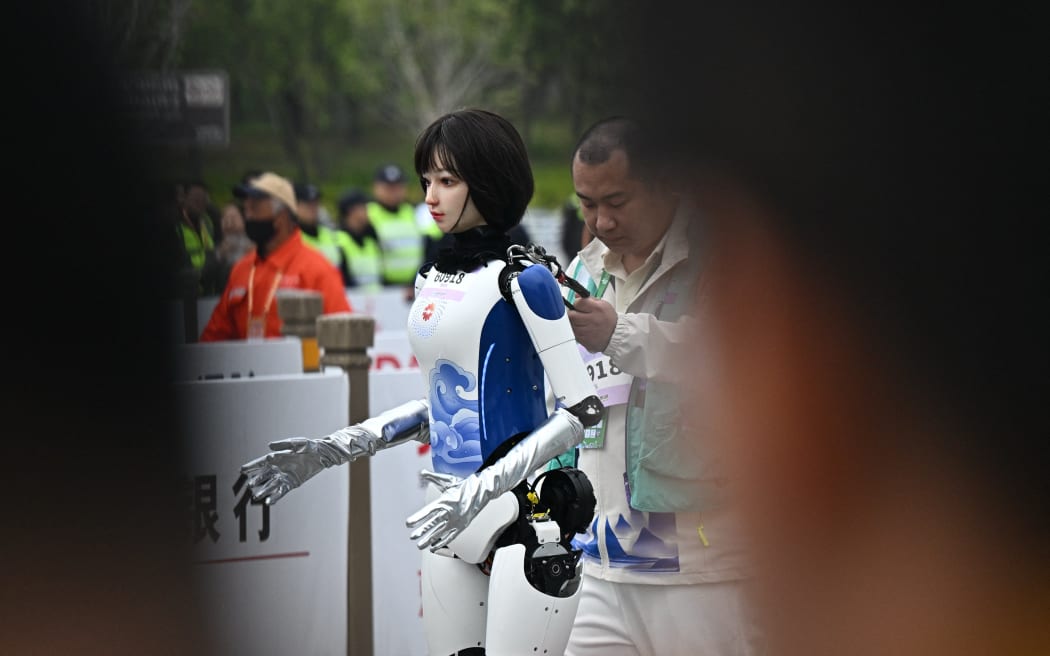 A robot takes part in the humanoid robot half marathon in Beijing.