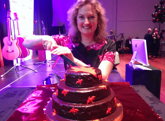 Chair Victoria Spackman with Bats'  birthday cake.