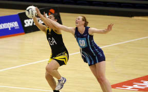 Amy Christophers and Wellington's Monalisa Groom in action during match between Hamilton and Wellington at the Lion Foundation Netball Champs held in Auckland in 2014. Photo Credit ©Michael Bradley.