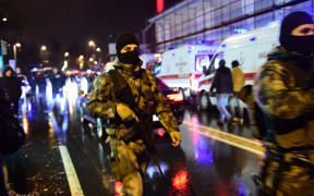 Turkish special force police officers and ambulances are seen at the site of an armed attack January 1, 2017 in Istanbul.