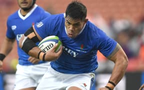 Samoan captain Michael Alaalatoa on the charge.