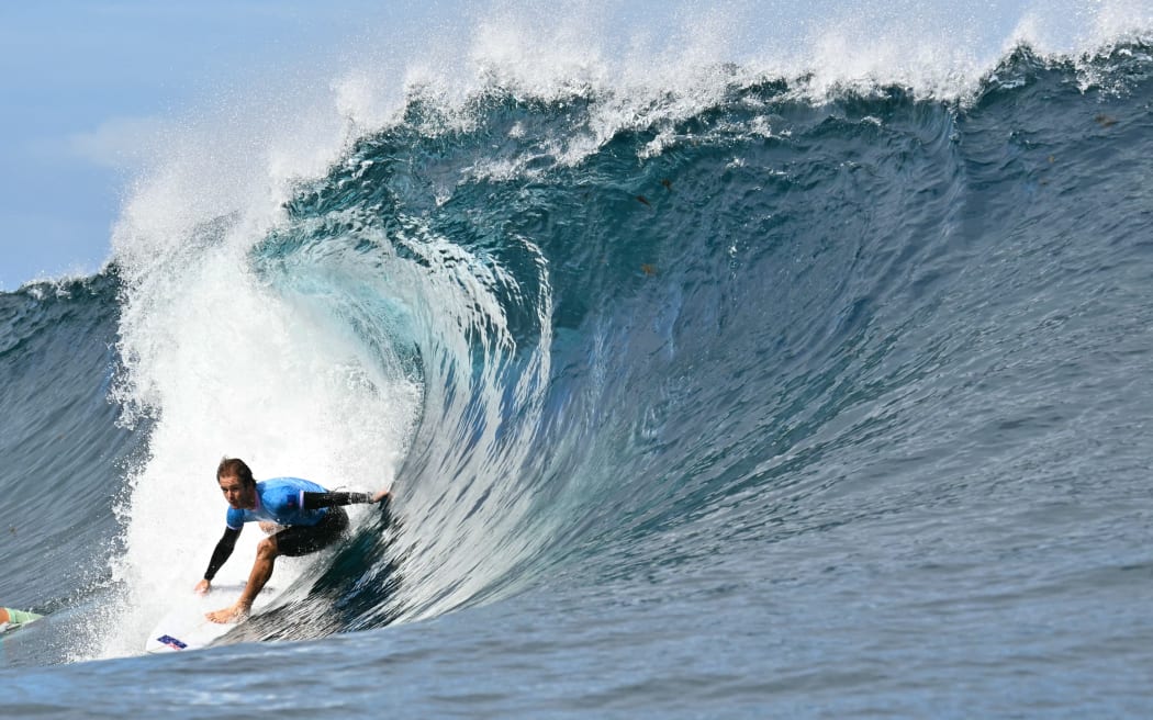 New Zealand's Billy Stairmand drops into a wave in the 5th heat of the men's surfing round 1, during the Paris 2024 Olympic Games, in Teahupo'o, on the French Polynesian Island of Tahiti, on July 27, 2024.