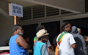 Voters on New Caledonia's restricted roll line up in 2018 independence referendum