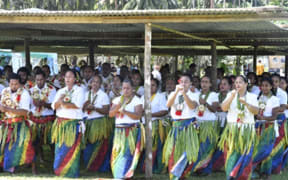Women and men of Rotuma perform a traditional dance for guests on Rotuma day.