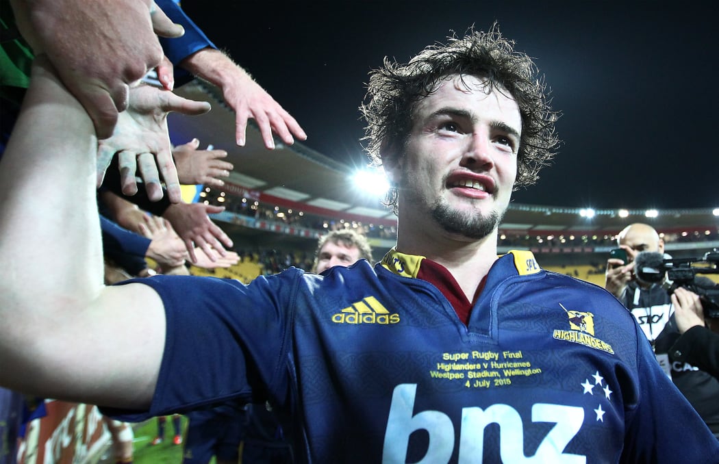 Highlanders' Richard Buckman celebrates with fans after their historic win.