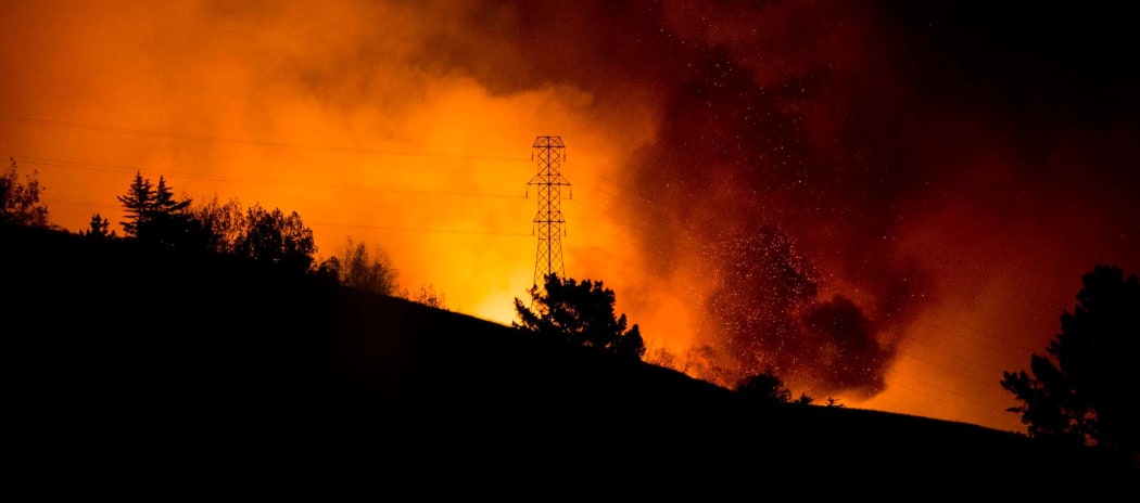 The fire burns above Victoria Park.