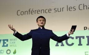 Alibaba chief executive Jack Ma delivers a speech during the Paris COP21 "Action Day".