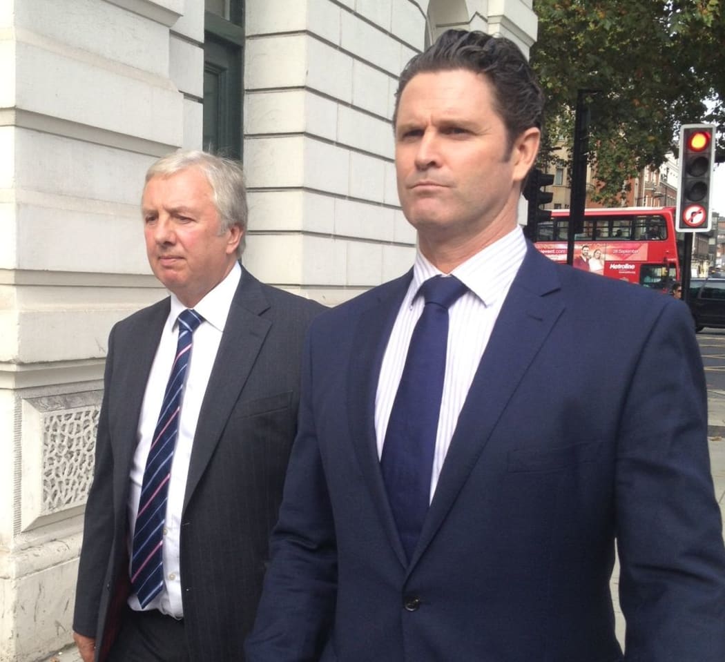 Chris Cairns (right) and his lawyer Colin Nott leave Westminster Magistrates Court.