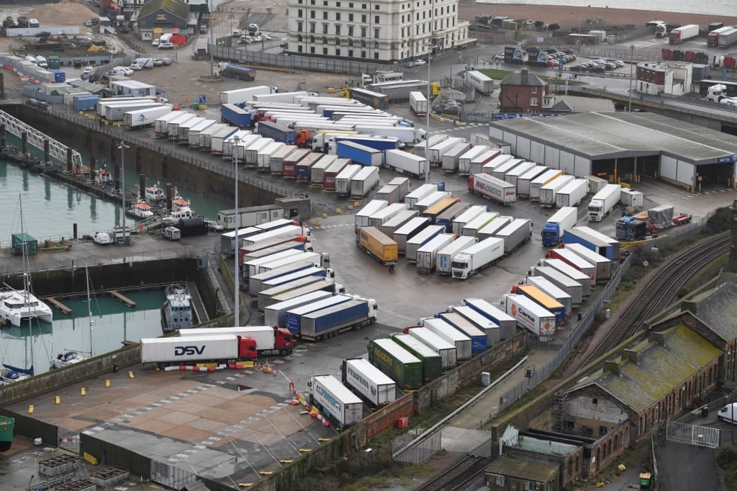 Freight lorries are seen parked at Dover Marina in Kent, south east England on December 22, 2020, adjacent to the Port of Dover as queuing trucks wait to continue their journeys after France closed its borders to accompanied freight arriving from the UK
