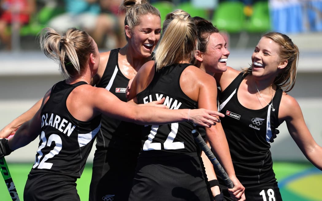 New Zealand's Kelsey Smith (2nd R) clebrates her goal with teammates during the the women's quarterfinal field hockey New Zealand vs Australia match of the Rio 2016 Olympics Games at the Olympic Hockey Centre in Rio de Janeiro on August 15, 2016.