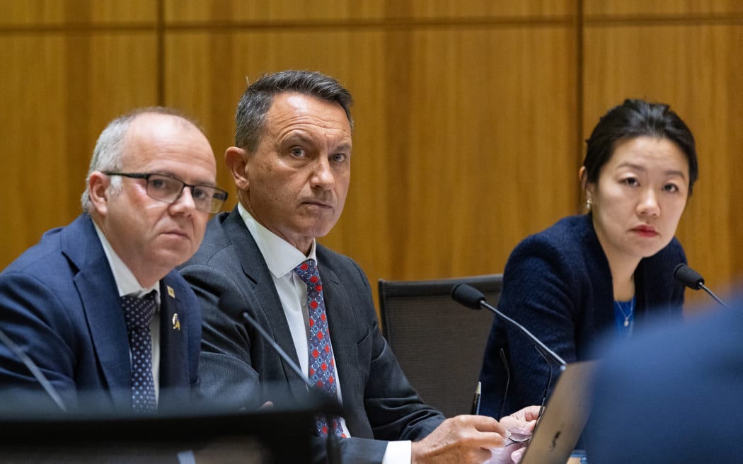 ACT MP Todd Stephenson, and National Party MPs David McLeod and Nancy Lu listen to evidence in select committee.