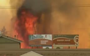 Flames close in on buildings in Fort McMurray.