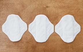 Reusable eco natural pads. White feminine washable, healthy and eco friendly pads from cotton and polyester. Stop plastic pollution. Free from perfume and chlorine. Zero waste lifestyle