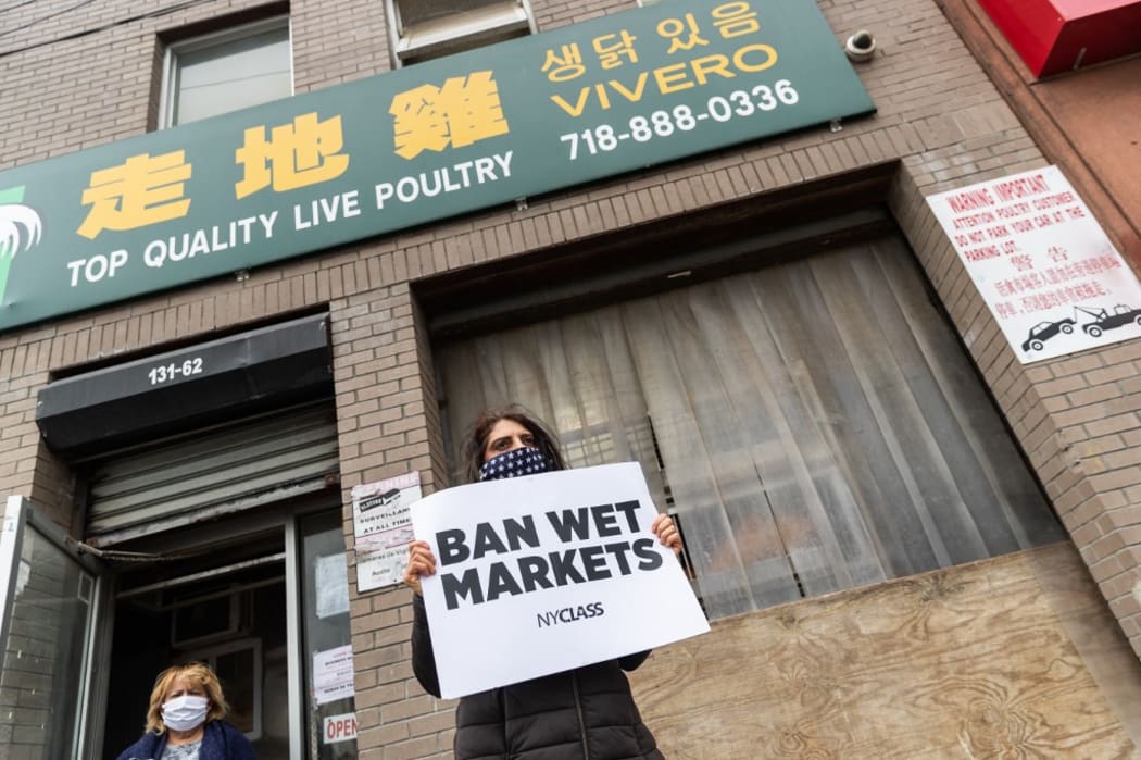 Members of NYCLASS protests outside a live-animal (wet) market in the Queens borough of New York City. PETA supporters and members of Slaughter Free NYC and other animal rights groups, concerned about the possible spread of disease, are holding protests to shut down live-animal markets