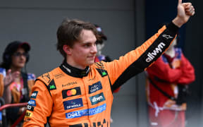 Oscar Piastri of McLaren celebrates