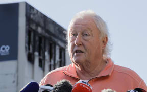 Loafers Lodge director Greg Mein speaks to media outside the partly collapsed building, in Adelaide Road, Wellington, the day after the fatal fire. 17 May 2023.