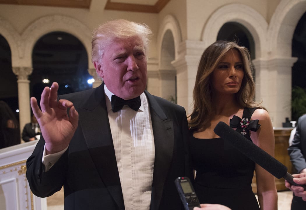 US President-elect Donald Trump answers questions from reporters on 31 December at Mar-a-Lago in Palm Beach, Florida.
