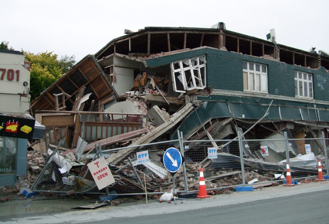 A photo taken on February 22, 2011 shows a collapsed row of shops on Worcester Street in Christchurch.