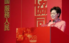 Chief Executive of Hong Kong Special Administrative Region Carrie Lam addresses the inauguration ceremony of an exhibition on Chinese scientists and the moon sample in Hong Kong, south China, June 26, 2021.