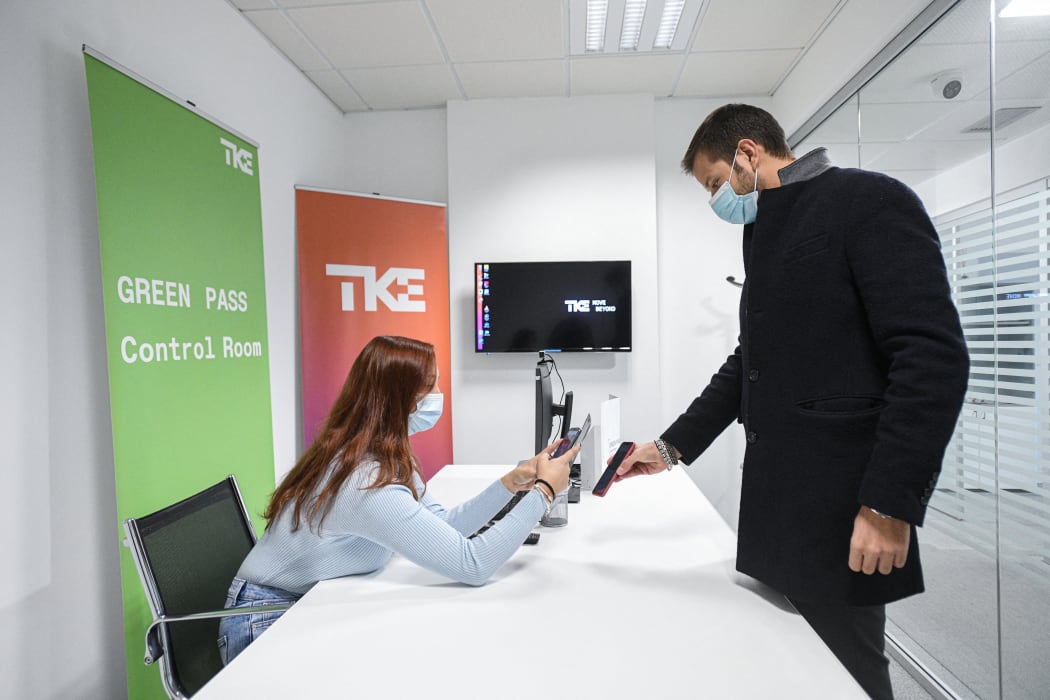 A ThyssenKrupp Elevator employee has his Covid-19 health pass checked before entering the company's headquarter on the first day the green pass becomes compulsory for all Italian public and private workers.