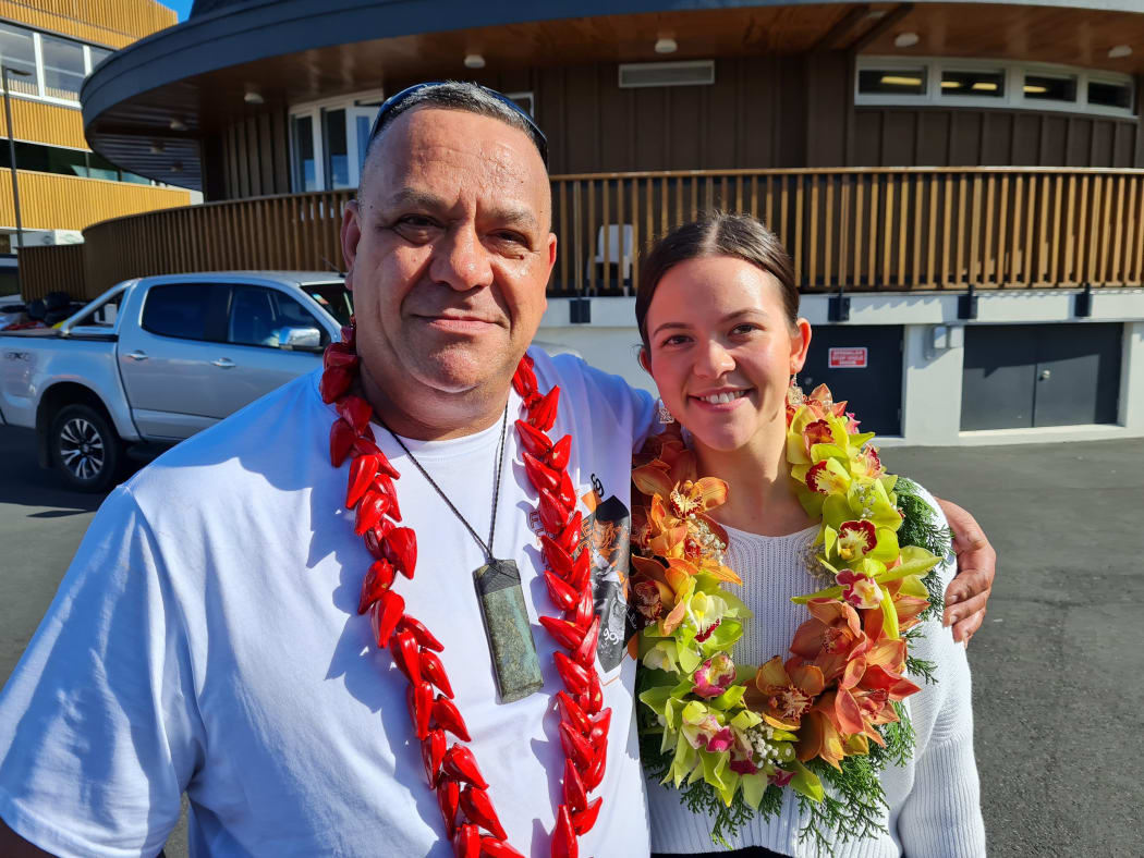 David Crichton standing with his daughter.