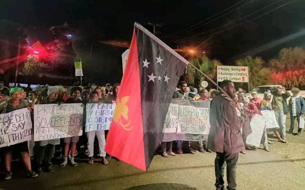 Students from the University of Goroka stage an early morning protest against the signing of a PNG-US Bilateral Defense Cooperation Agreement. 22 May 2023