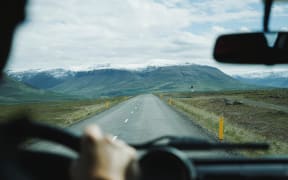 road and mountains from truck cab