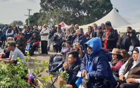 People gathering to hear the karakia and waiata from the Ratana faith, and other religious groups at Ihumātao on Sunday, 28 July.