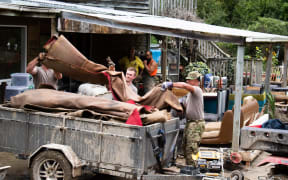 The NZDF help clear out a damaged Tinui home after Cyclone Gabrielle.