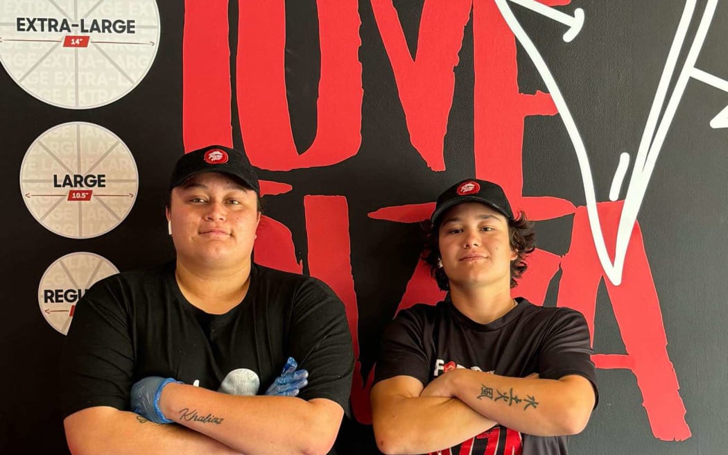 22-year-old Caitlyn Lewin, alongside her best mate Bailey Robertson, who left job to help open the Tawa Pizza, fulfilling a promise made years earlier over drinks.