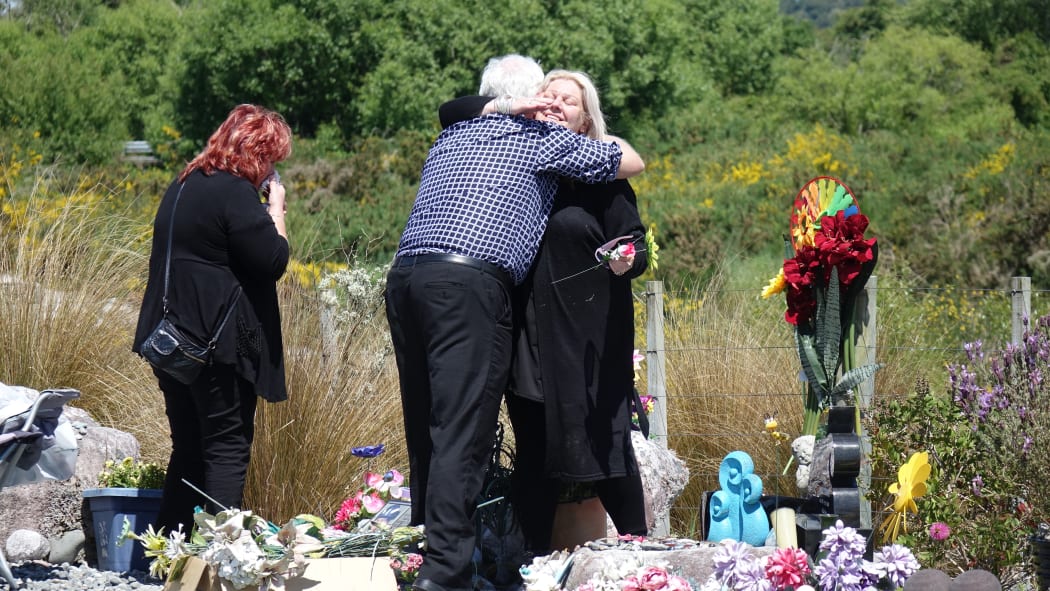 Sonya Rockhouse receives a hug from Bernie Monk at a memorial site for 29 men near the turnoff to the Pike River Mine. 
 


CONAN YOUNG / RNZ